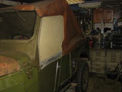 Сделал новую надставку на дверь из брезента.